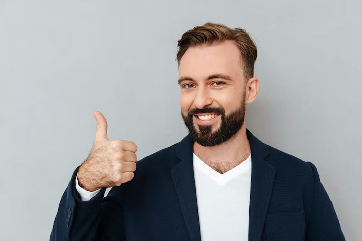 files/cheerful-bearded-man-busines-clothes-showing-thumb-up-looking-camera-gray_171337-11351.jpg